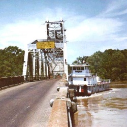 Tug meets bridge